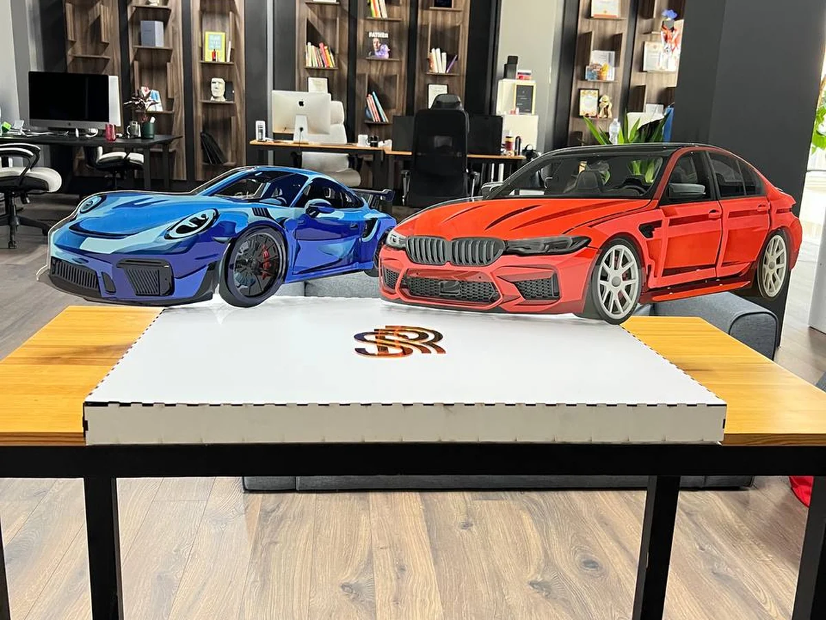 Blue and red StackRise models together in an office space
