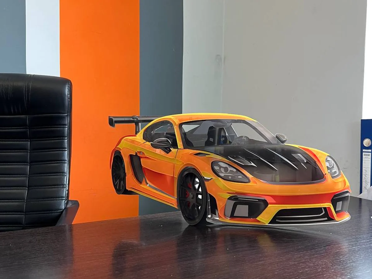 Orange StackRise model on a desk in an office